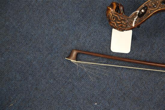 A decorative violin, bearing Gaspar da Salo label, body 14.5in., overall 23.5in., cased with a bow